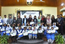 Chief Guest Parliamentary Secretary Mehnaz Aziz and Principal Prof Sabah Faisal in a group photograph with prize winners students of speech contest during prize distribution ceremony in connection with Golden Jubilee celebrations of constitution of Pakistan at Islamabad Model College for Girls F10-2