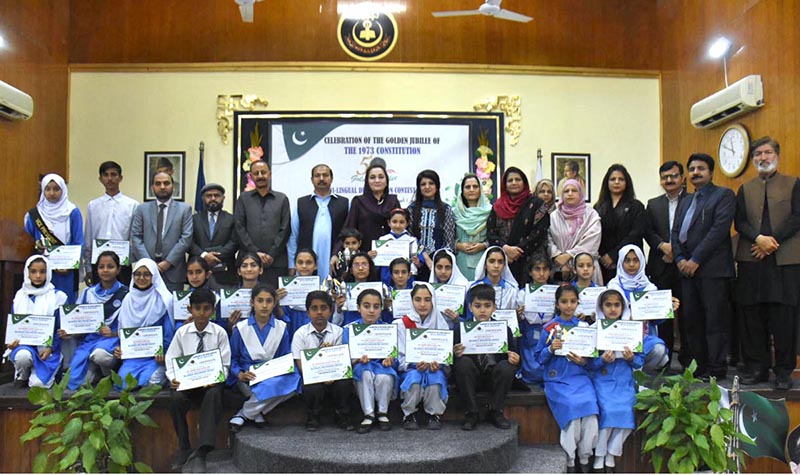 Chief Guest Parliamentary Secretary Mehnaz Aziz and Principal Prof Sabah Faisal in a group photograph with prize winners students of speech contest during prize distribution ceremony in connection with Golden Jubilee celebrations of constitution of Pakistan at Islamabad Model College for Girls F10-2