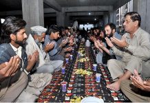 People offering dua before break their fast organized by the volunteers in the Federal Capital