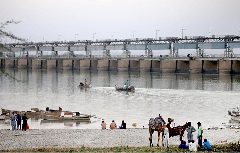 People enjoying boat riding at Al-Manzar picnic point at the bank of River Indus at Jamshro