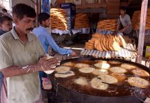 Workers busy in preparing vermicelli (Pheoni) during Holy fasting month of Ramazan at his workplace