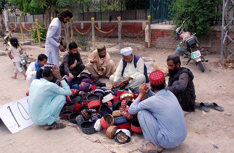 Some people are buying caps from roadside during the holy month of Ramadan