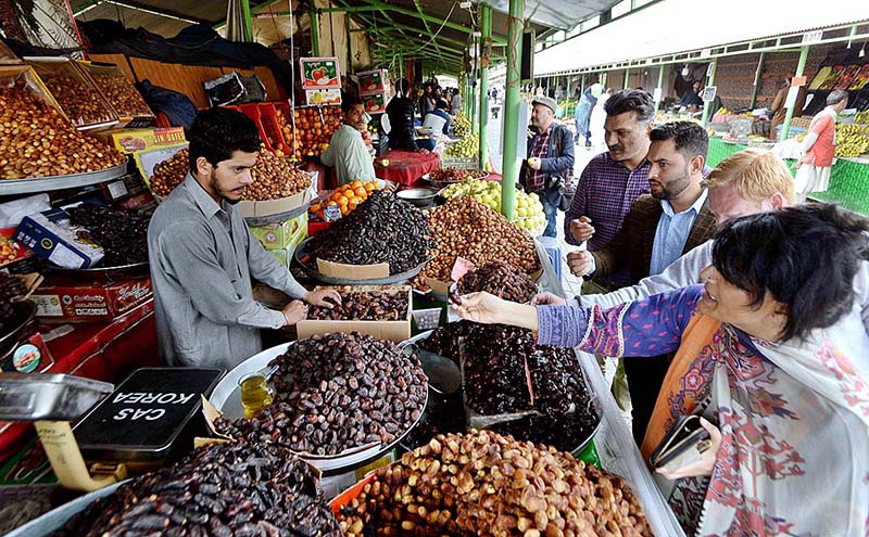 People purchasing dates for upcoming Holy Month Ramadan at Margalla Ramzan Bazar