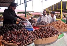 A vendor selling dates during holy fasting month at sasta Ramzan Bazar Abpara in the Federal Capital