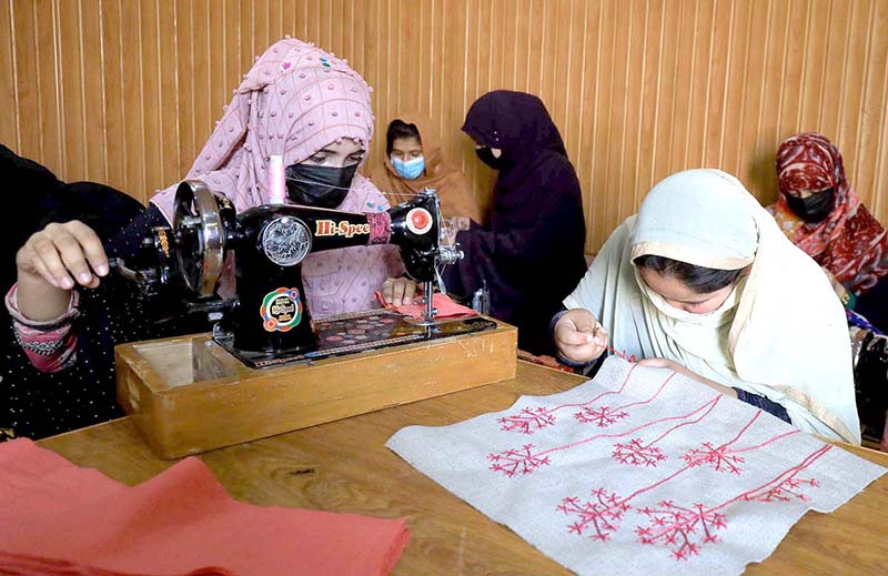 A large number of women attending a tailoring class at Sana Skill Academy Centre at the Board Tajabad area