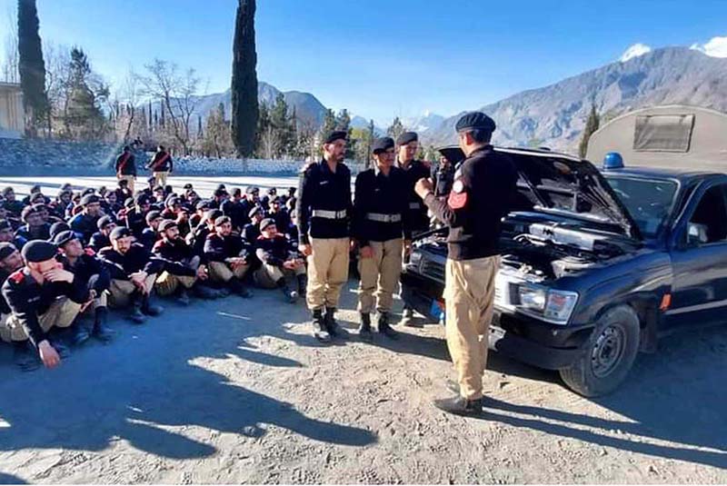 Ladies Police driving trainer giving instruction to police personnel during the training session