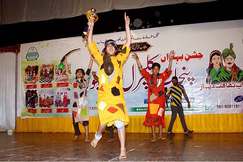 Students performing (Dhamal) on the stage during Punjab Culture festival at Arts Council