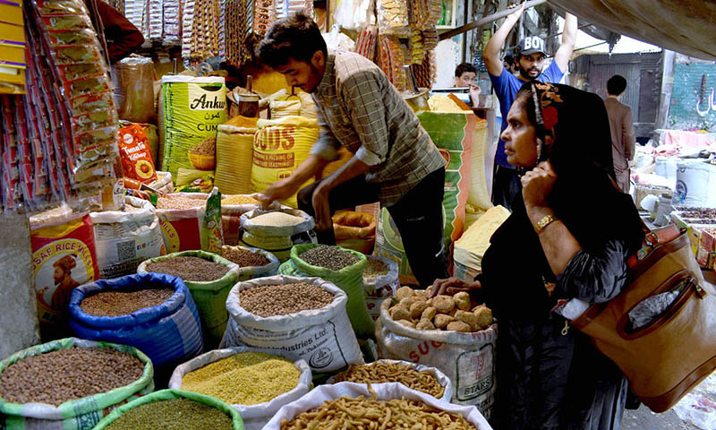 A shopkeeper is selling Masalsa jata used in food items at Delhi Darwaza Bazar