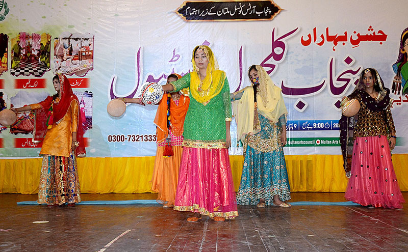 Students performing (Dhamal) on the stage during Punjab Culture festival at Arts Council