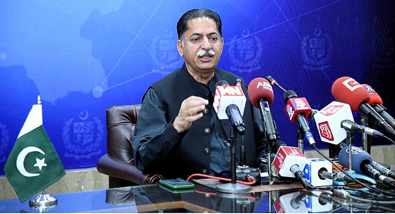Federal Minister Mian Javed Latif addressing an important press conference