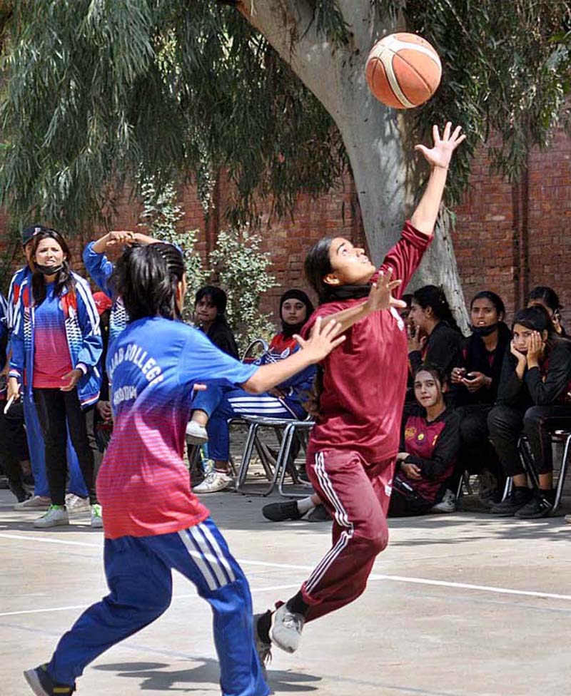 Basketball women players in action during a match played between Punjab College and Aminent College at inter-collegiate basketball tournament organized by Sargodha Board