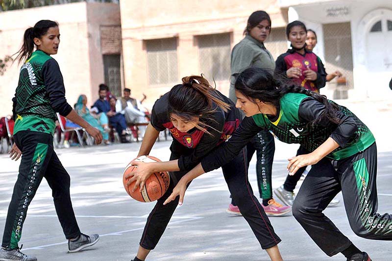 Basketball women players in action during a match played between Punjab College and Aminent College at inter-collegiate basketball tournament organized by Sargodha Board