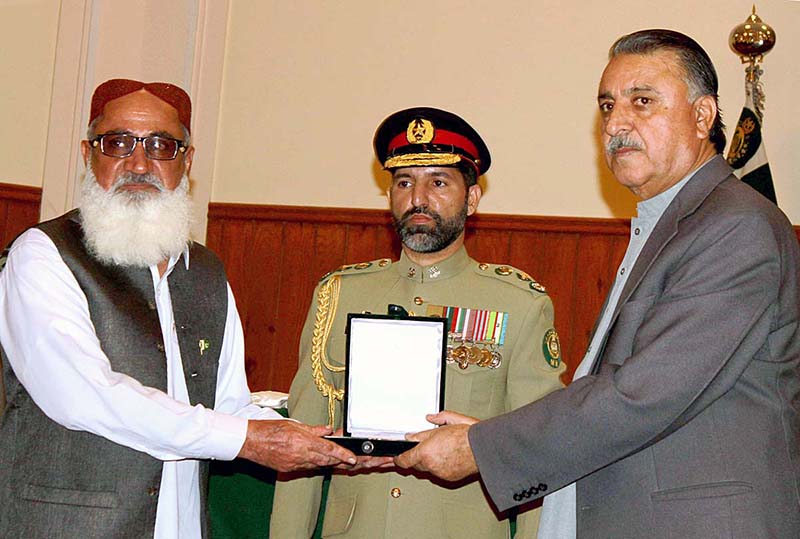 Governor Balochistan Malik Abdul Wali Kakar conferring Presidential and Excellence Awards on various personalities for their outstanding performance and best services during a ceremony on Pakistan Day held at Governor House