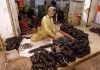 A workers busy in sorting and packing bangles at their workplace in Bangles Market