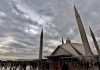 An attractive view of clouds hovering over the Faisal Masjid as large number of faithful coming out after offering Namaz-e-Jumma (Friday Prayer) during Holy fasting month of Ramzan.