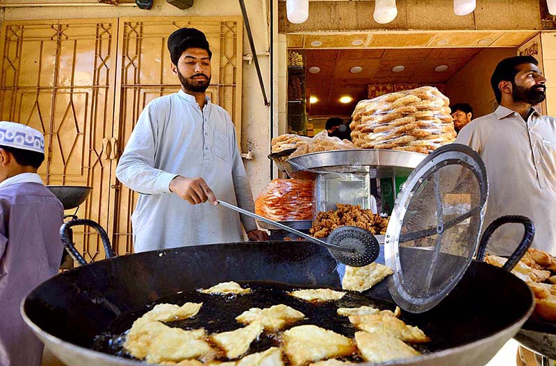 A vendor selling and displaying traditional food item Kachalu Pera during the holy fasting month of Ramzan Ul Mubarak at Hashtnagri area