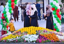 Women and children visiting flowers exhibition during three days jashan-e-baharan flowers show at Shaheed e Millat Park