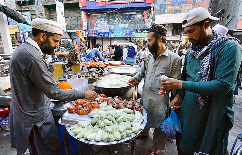 Vendor displaying and selling different types of sweet and sour sauce during the holy fasting month of Ramzan.