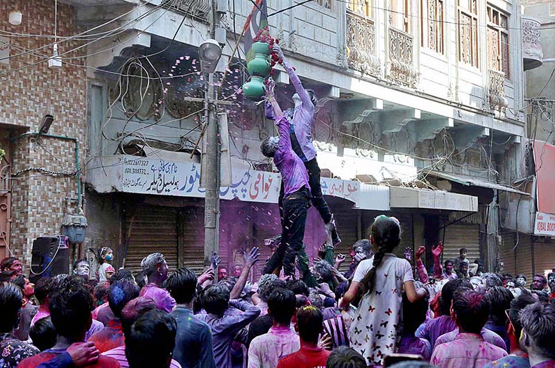 Hindu women celebrating Holi festival of colors at Durga Shiv Mandir