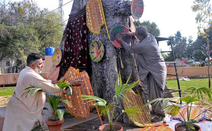 A person displays a stall at Jilani Park organized by PHA is preparing items to attract customers during Jashan Baharan Festival