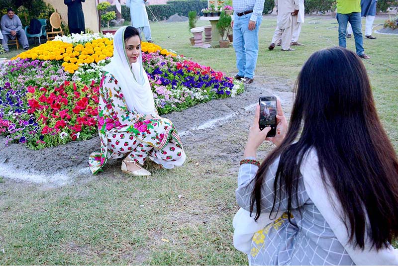 Women and children visiting flowers exhibition during three days jashan-e-baharan flowers show at Shaheed e Millat Park