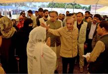 Prime Minister Muhammad Shehbaz Sharif is talking to people at free flour distribution point set up at Bahawalpur Stadium