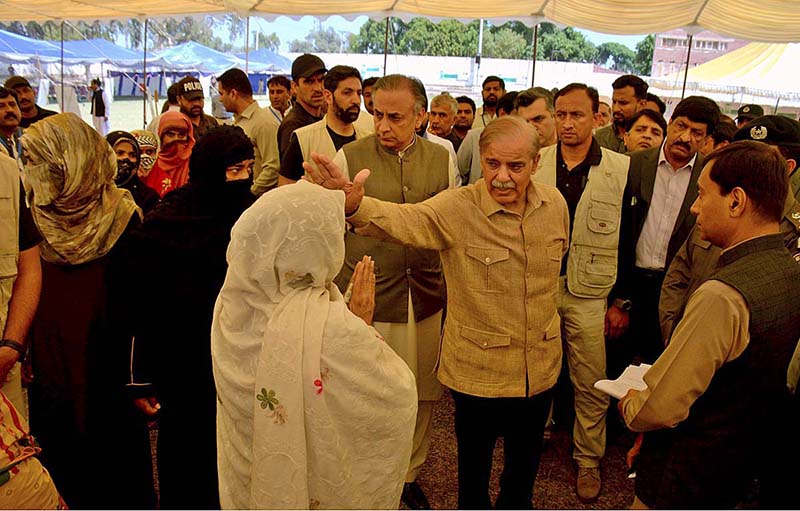 Prime Minister Muhammad Shehbaz Sharif is talking to people at free flour distribution point set up at Bahawalpur Stadium