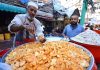 A vendor selling and displaying traditional food item Kachalu Pera during the holy fasting month of Ramzan Ul Mubarak at Hashtnagri area