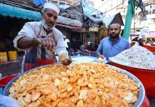 A vendor selling and displaying traditional food item Kachalu Pera during the holy fasting month of Ramzan Ul Mubarak at Hashtnagri area