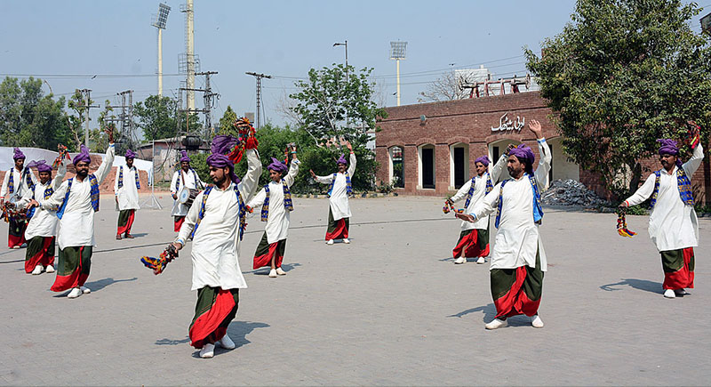 The artists are presenting Jhomar dance on the beat of drum in relation with the Punjab Culture Day at the Arts Council