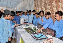 Students visiting various stalls science projects during an exhibition at Government Technical Training Institute Jinnah Colony Road Faisalabad