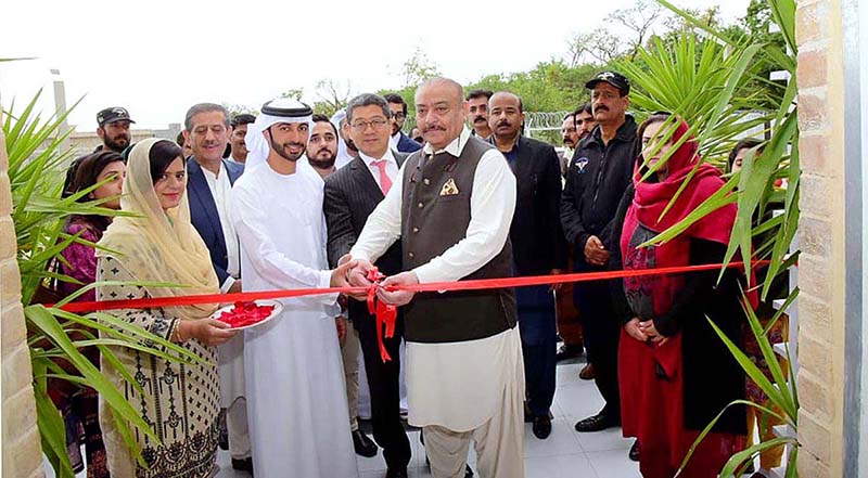 Federal Minister for National Health Services Abdul Qadir Patel cutting ribbon to inaugurate Regional blood center Islamabad with a High level deleligation of UAE in federal Capital.
