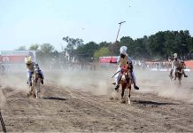 Players participating in tent pegging championship arranged by University of Agriculture Faisalabad (UAF) at Sports Ground in connection with Spring Festival celebrations