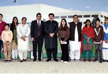 Chairman Senate, Muhammad Sadiq Sanjrani in a group photo with a delegation of minorities children at Parliament House