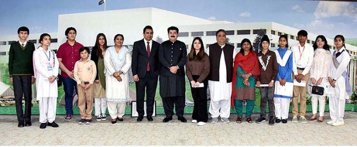Chairman Senate, Muhammad Sadiq Sanjrani in a group photo with a delegation of minorities children at Parliament House