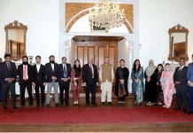 President Dr. Arif Alvi in a group photograph with delegation of PhD students at Governor House