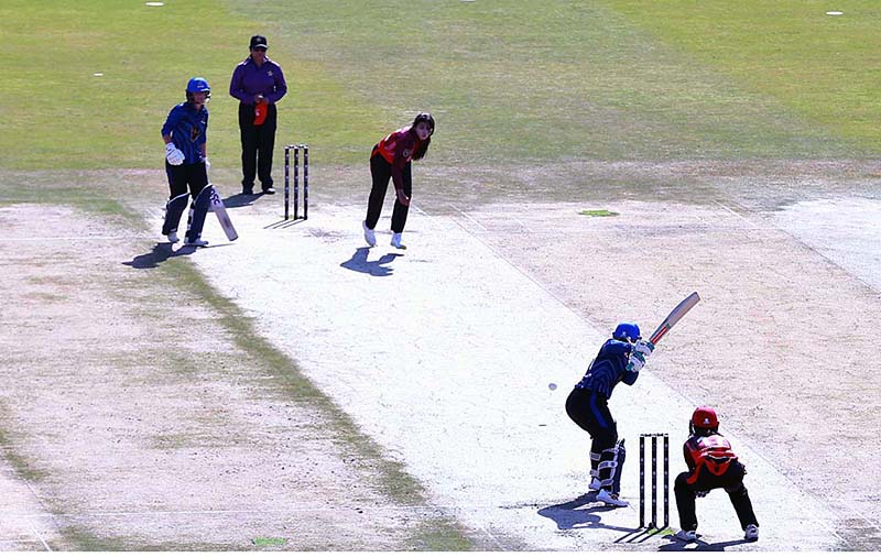 Women cricket players in action during a cricket exhibition match at Rawalpindi Cricket Stadium to mark the International Women's Day