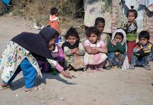Children playing glass ball game at Hussenabad Area