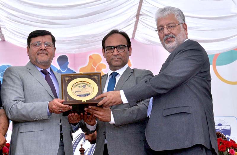Vice Chancellor University of Sargodha Professor Dr Qaiser Abbas and Chairman Higher Education Commission Professor Dr. Mukhtar Ahmed presenting souvenir to Commissioner Sargodha Muhammad Ajmal Bhatti at the Opening Ceremony of Higher Education Commission Sports Gala at University of Sargodha