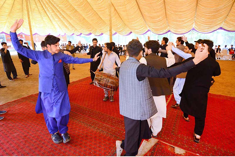 Students performing bhangra on dhool during Spring Festival at PMDC Boys Dalazak road