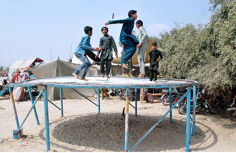 Children enjoy are jumping on trampoline in a festival in the suburbs of Bahawalpur