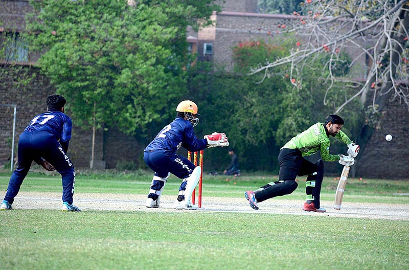 Cricket players in full action during cricket match played between State Bank and Habib Bank Limited teams for State Bank Governor Cup 2023 at Bohranwali Ground