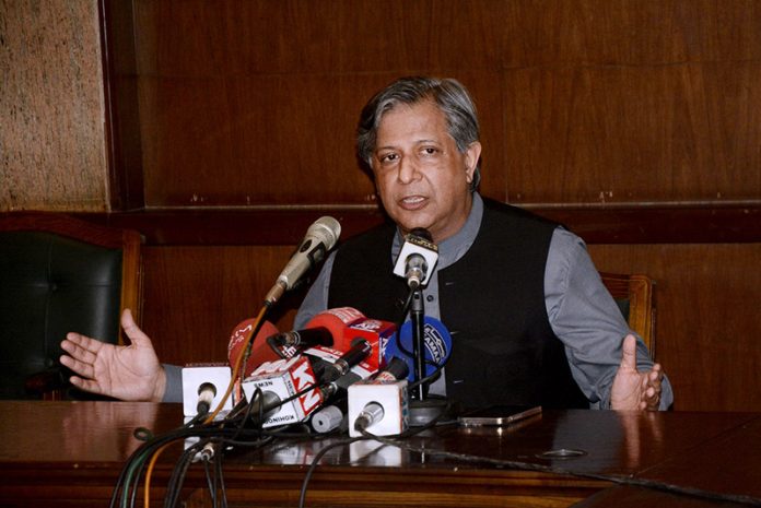 Federal Minister for Law and Justice, Azam Nazir Tarar addressing a press conference at 180 h Model Town