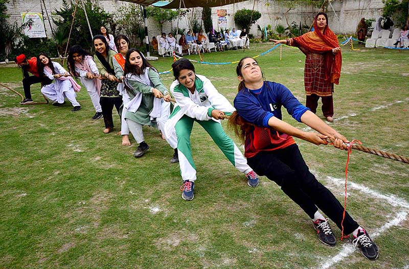 Students participating in Tug Of War competition during Jashn-e-Baharan Sports Festival at Government City Girls College