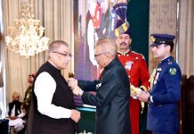 President Dr. Arif Alvi conferring the Pakistan Civil Award of Hilal-i-Imtiaz upon Mujib-ur-Rahman Shami in recognition of his services in the field of Journalism at the Investiture Ceremony on Pakistan Day, held at Aiwan-e-Sadr