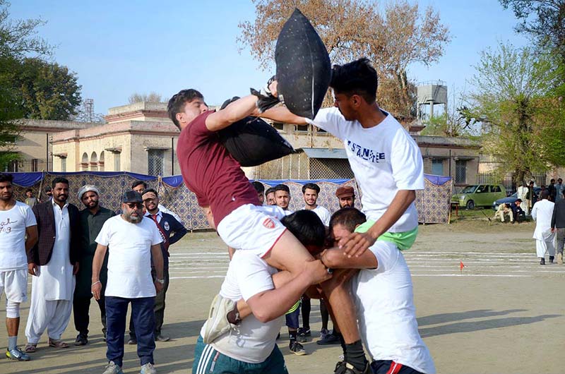 <em>Students participating in the pillow fighting competition during the annual competitions of Government Graduate College Attock</em>