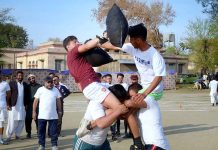 Students participating in the pillow fighting competition during the annual competitions of Government Graduate College Attock