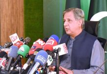 Federal Minister for Law and Justice, Senator Azam Nazeer Tarar addressing a press conference