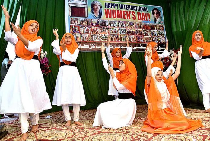 Students performing dance in a tableau during a function in connection with upcoming International Women Day at Gomi Bai Ladies Club