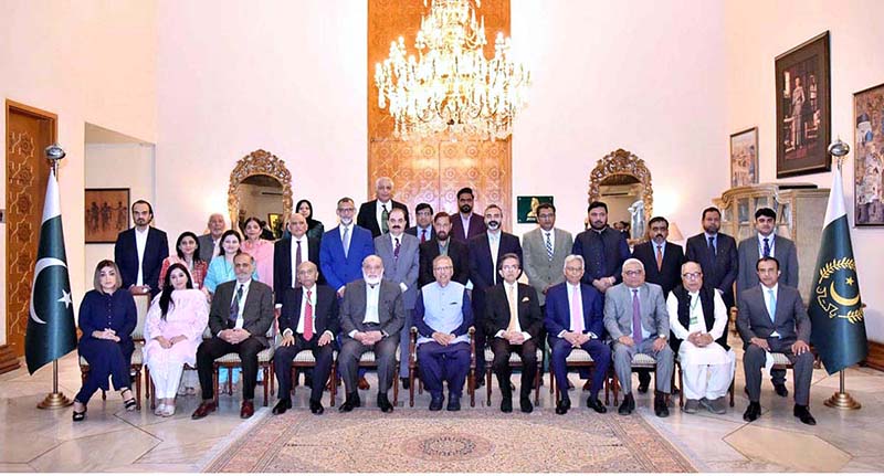 President Dr. Arif Alvi in a group photo with the organizers and speakers of the awareness seminar on "Digital System for Public Welfare: Weaknesses and Remedies", at Aiwan-e-Sadr